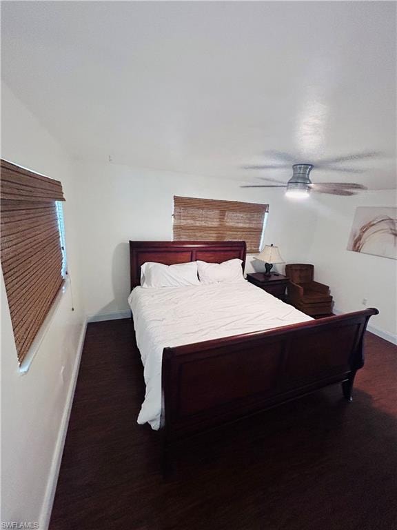 Bedroom featuring dark wood finished floors and ceiling fan