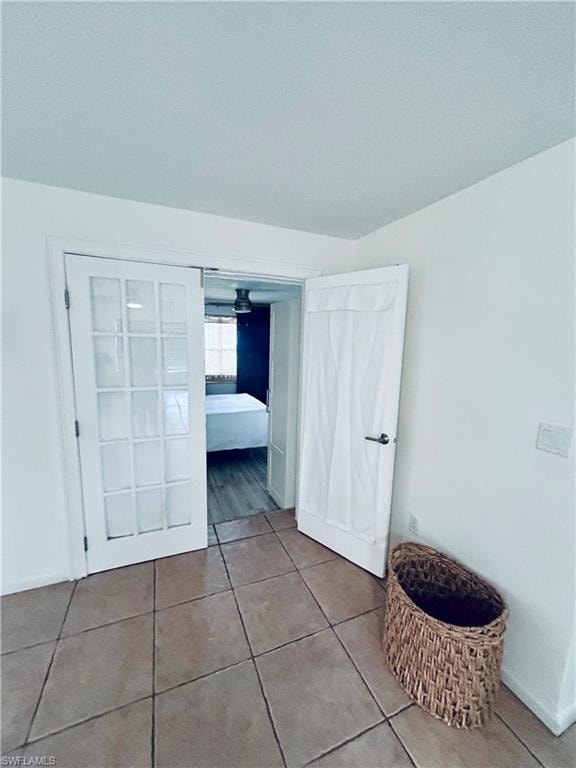 Unfurnished bedroom featuring tile patterned floors