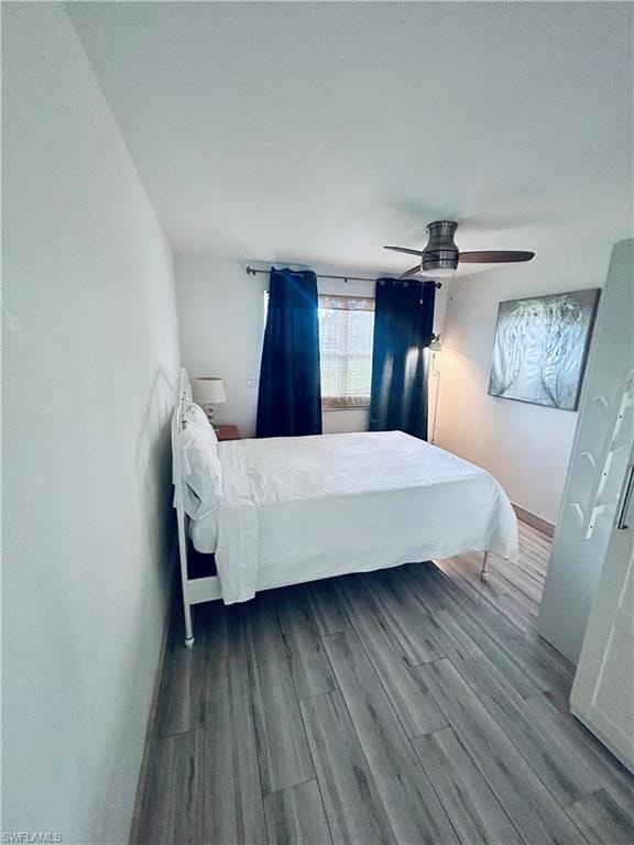 Bedroom featuring wood finished floors and a ceiling fan