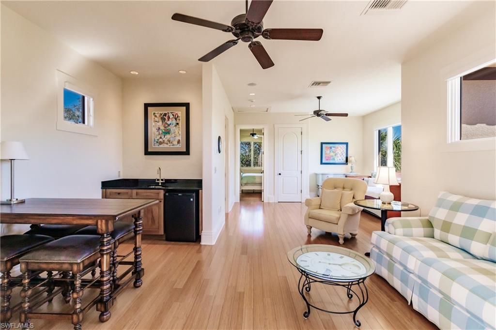 Private Guest Bedroom Suite with Wet Bar, Sitting Area, & Private Bath