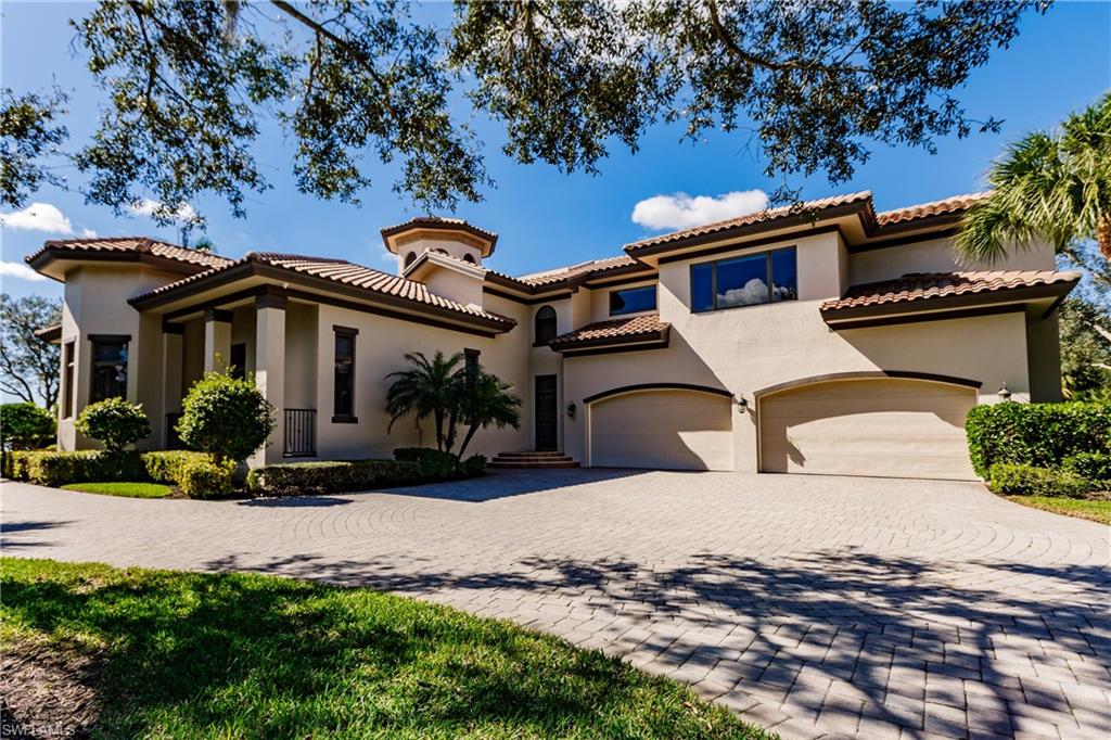 Side of Home with 4-Car Garage & Parking Area