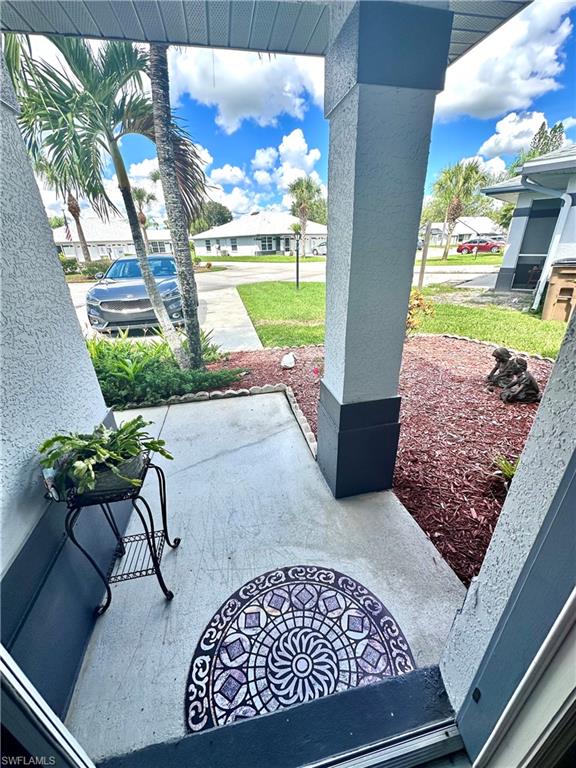 Covered porch with a residential view