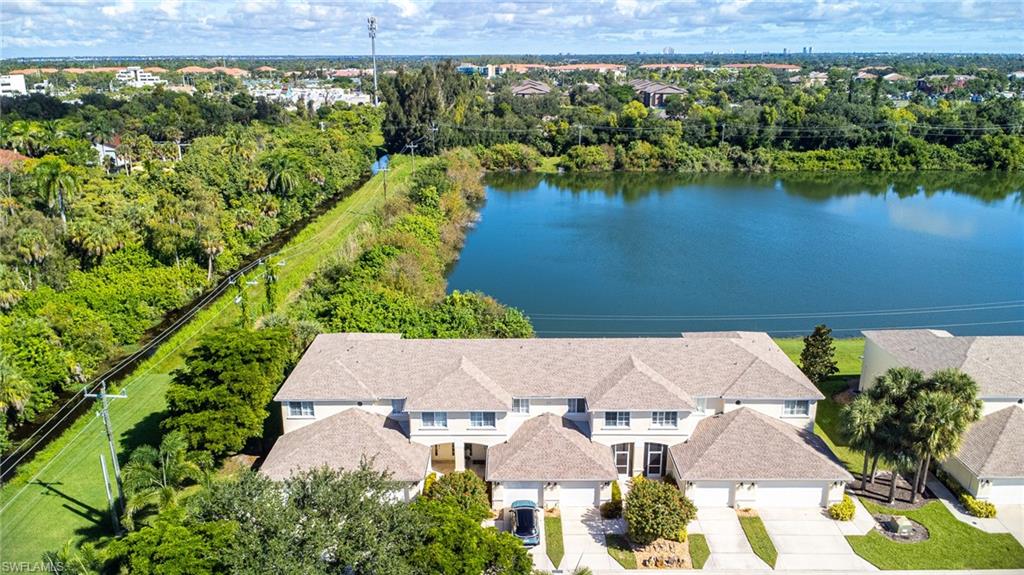 Aerial view of a large body of water and a tree filled landscape