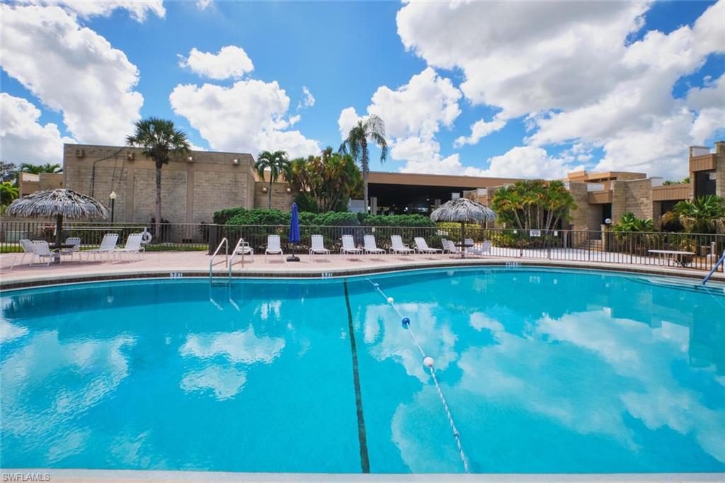 Community pool featuring a patio
