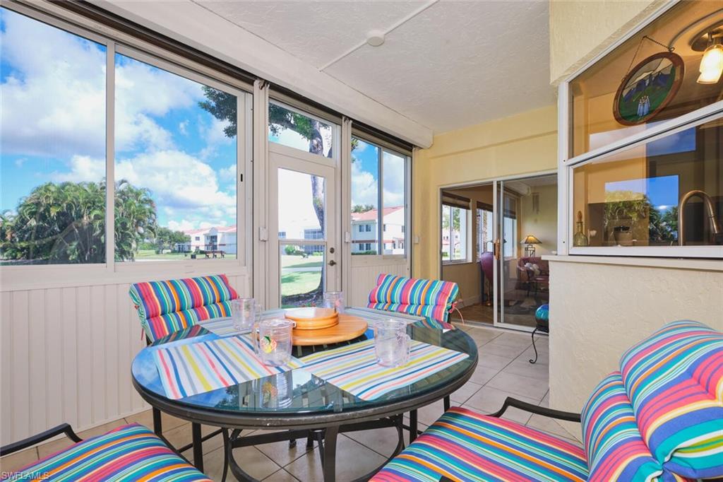 Large screened Lanai with sliders to Living Area and French doors to Primary Bedroom