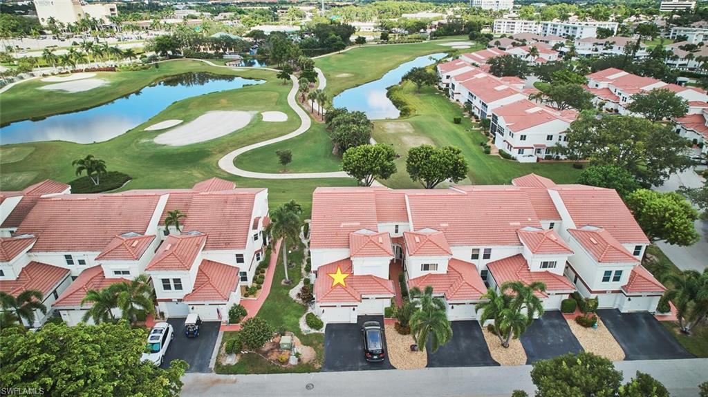 Bird's eye view of a local golf course and a nearby body of water