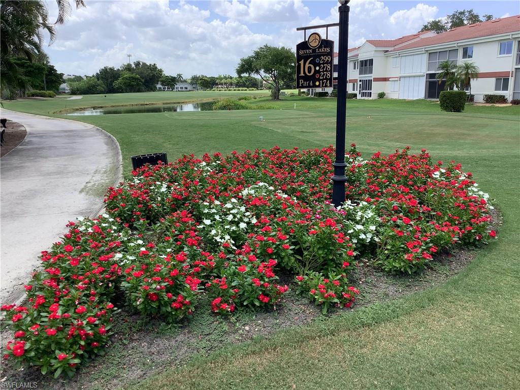View of Cart Path, pond & 16th Fairway from Living area