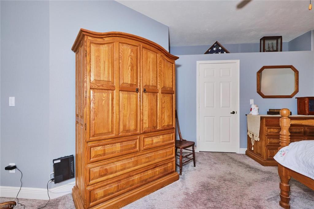 Primary Bedroom featuring light carpet and lots of room