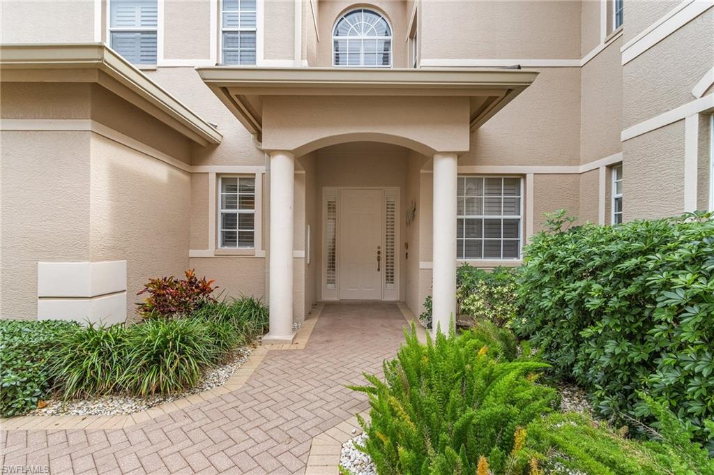Doorway to property with stucco siding