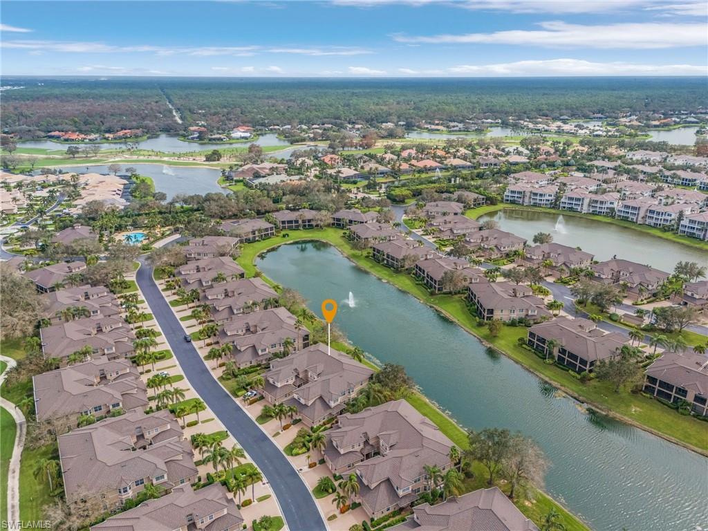Aerial overview of property's location featuring a large body of water and nearby suburban area