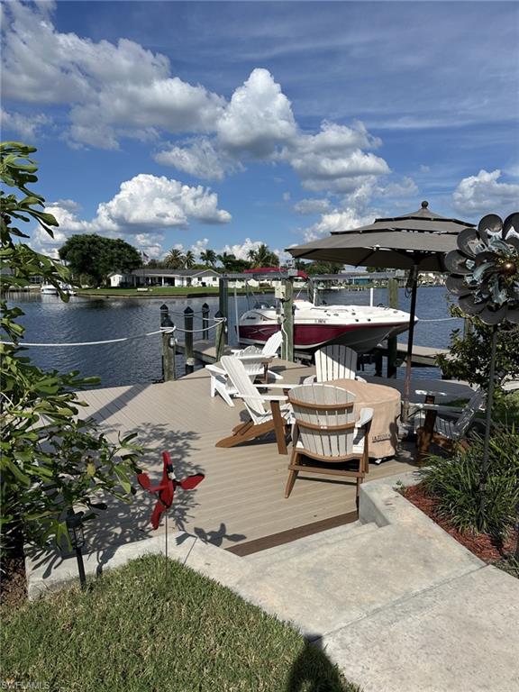 Dock area featuring a water view and boat lift