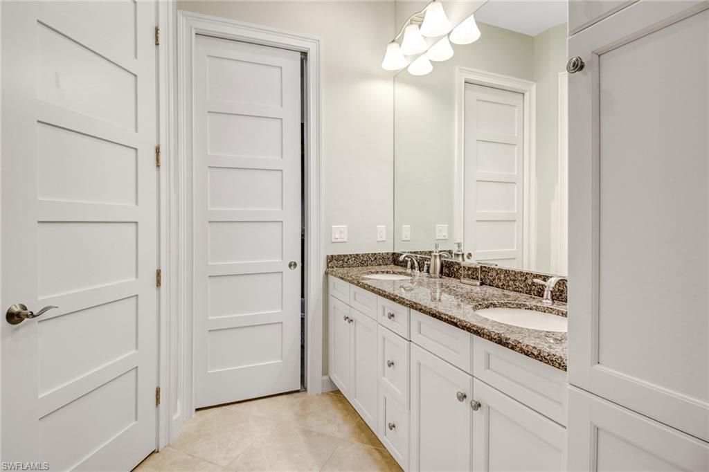 Bathroom featuring vanity and tile patterned flooring