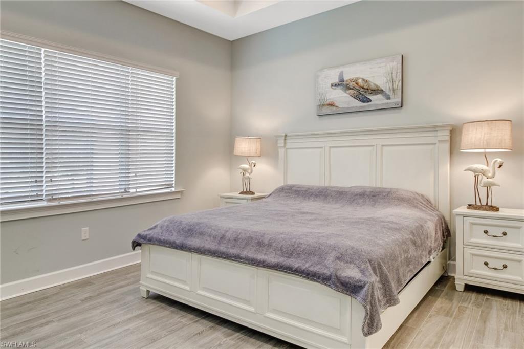 Bedroom with light hardwood / wood-style flooring