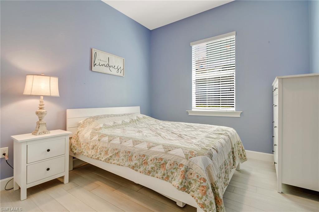 Bedroom with light hardwood / wood-style flooring