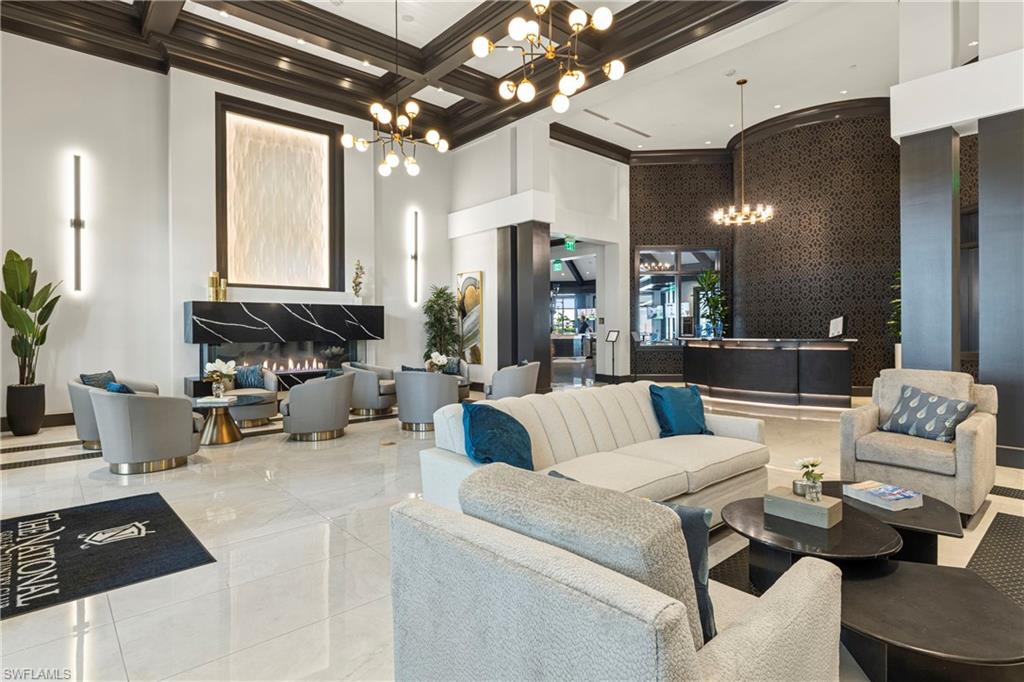 Community lobby with a towering ceiling, coffered ceiling, and beamed ceiling