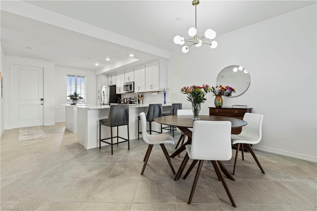 Dining area with a chandelier and recessed lighting