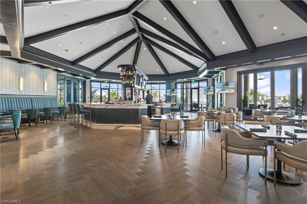 Lobby featuring beam ceiling and high vaulted ceiling