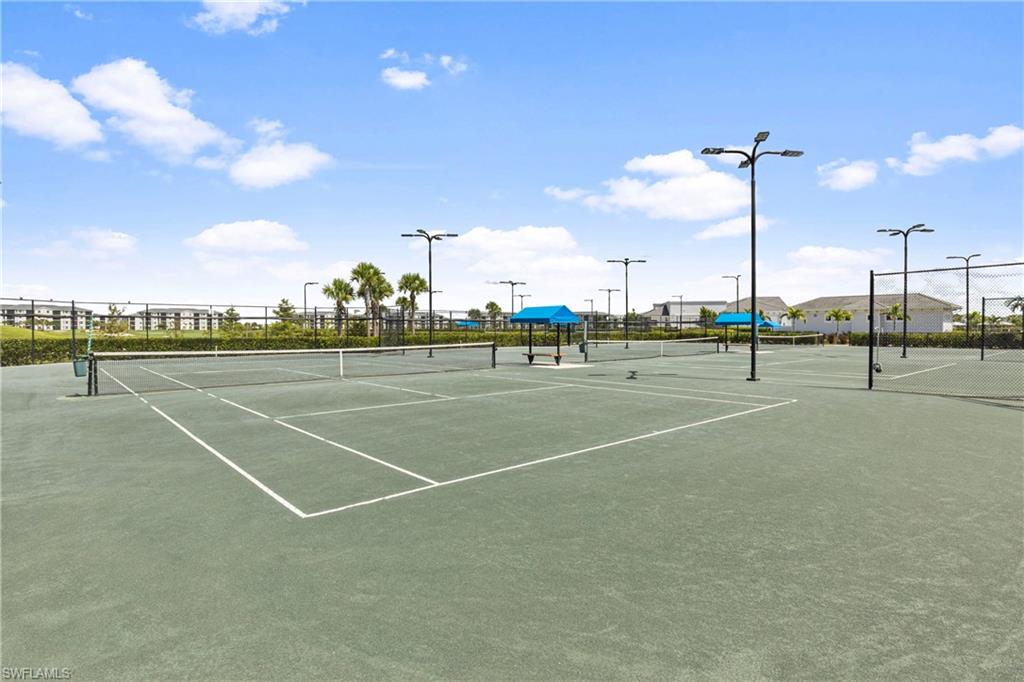 View of tennis court featuring community basketball court