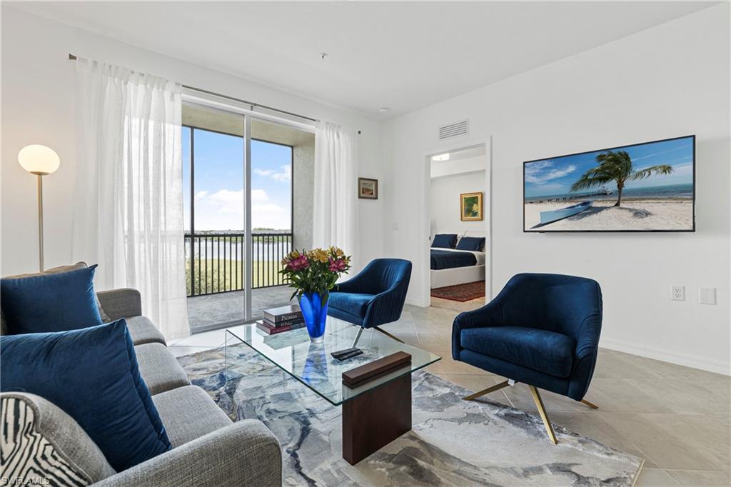 Living area featuring baseboards and tile patterned floors