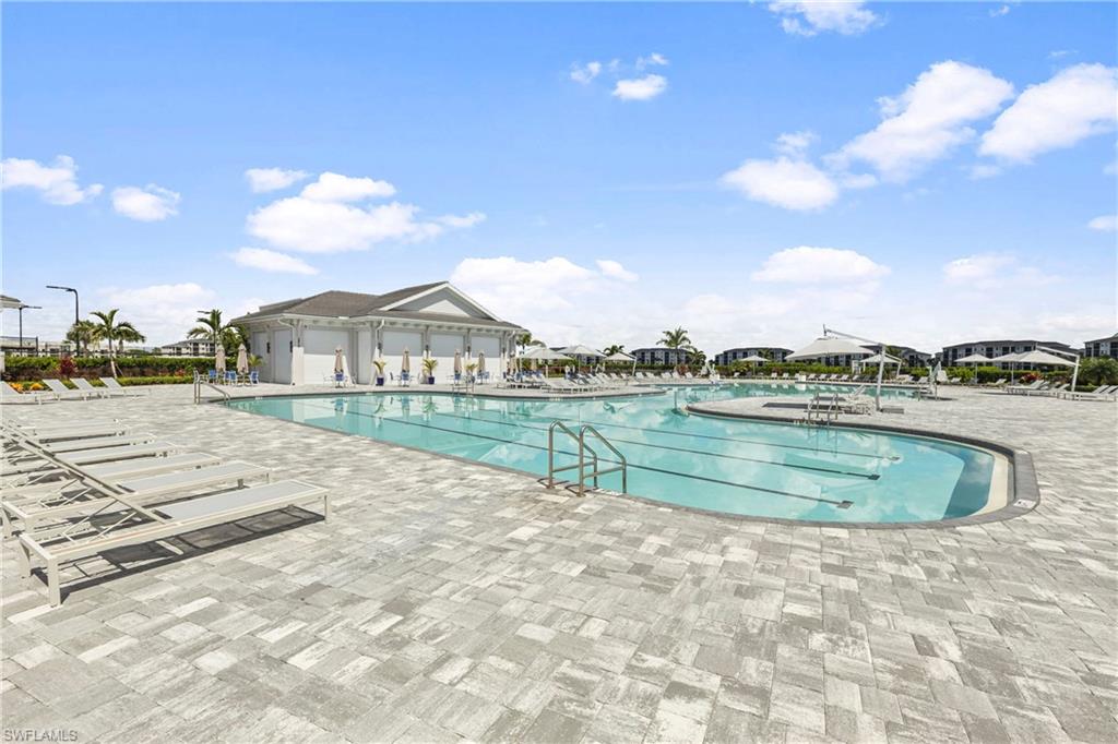 Community pool featuring a patio