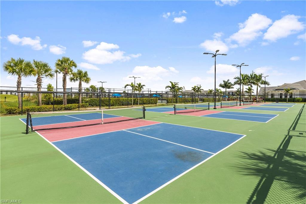 View of tennis court with community basketball court