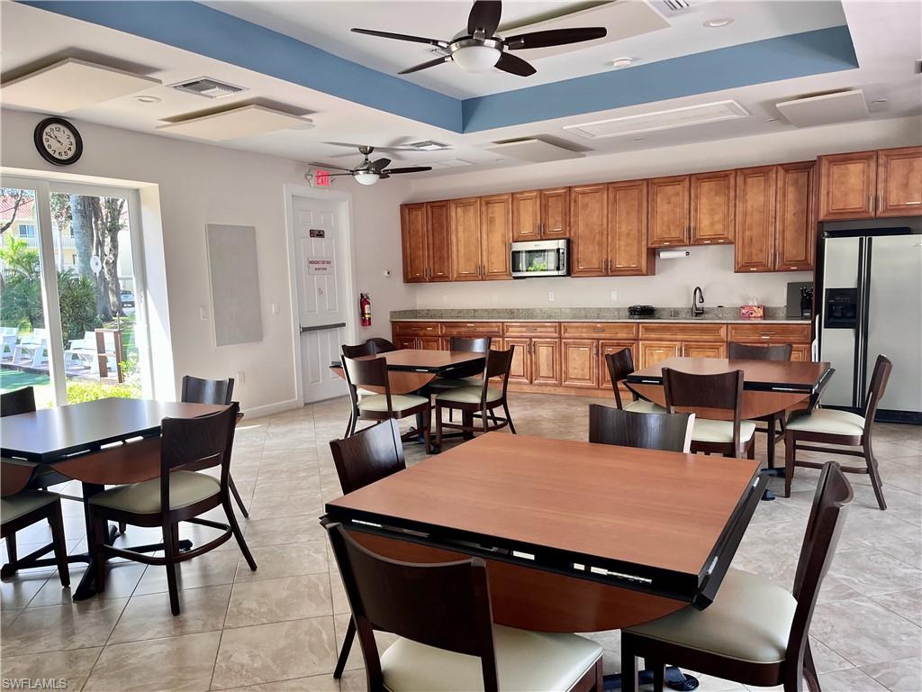 Community room features kitchen for entertaining near the pool