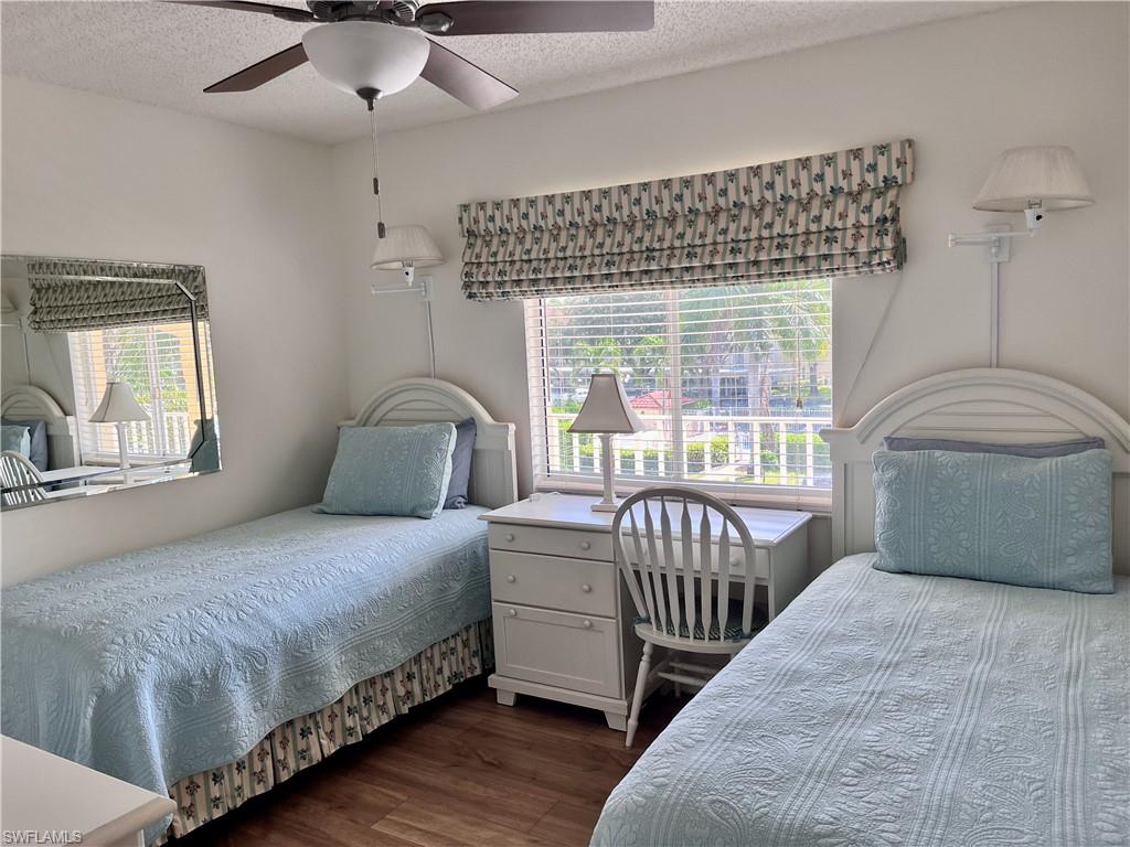 Bedroom with ceiling fan and twin beds