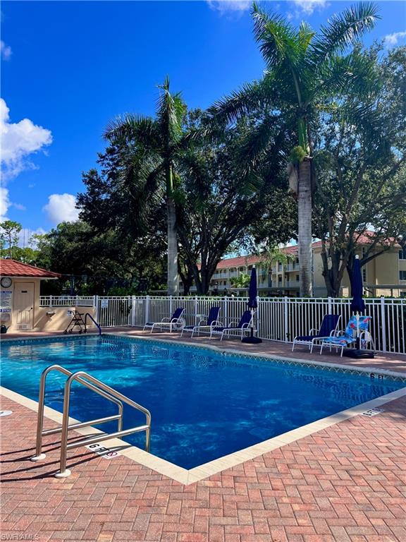 View of swimming pool just outside of the unit