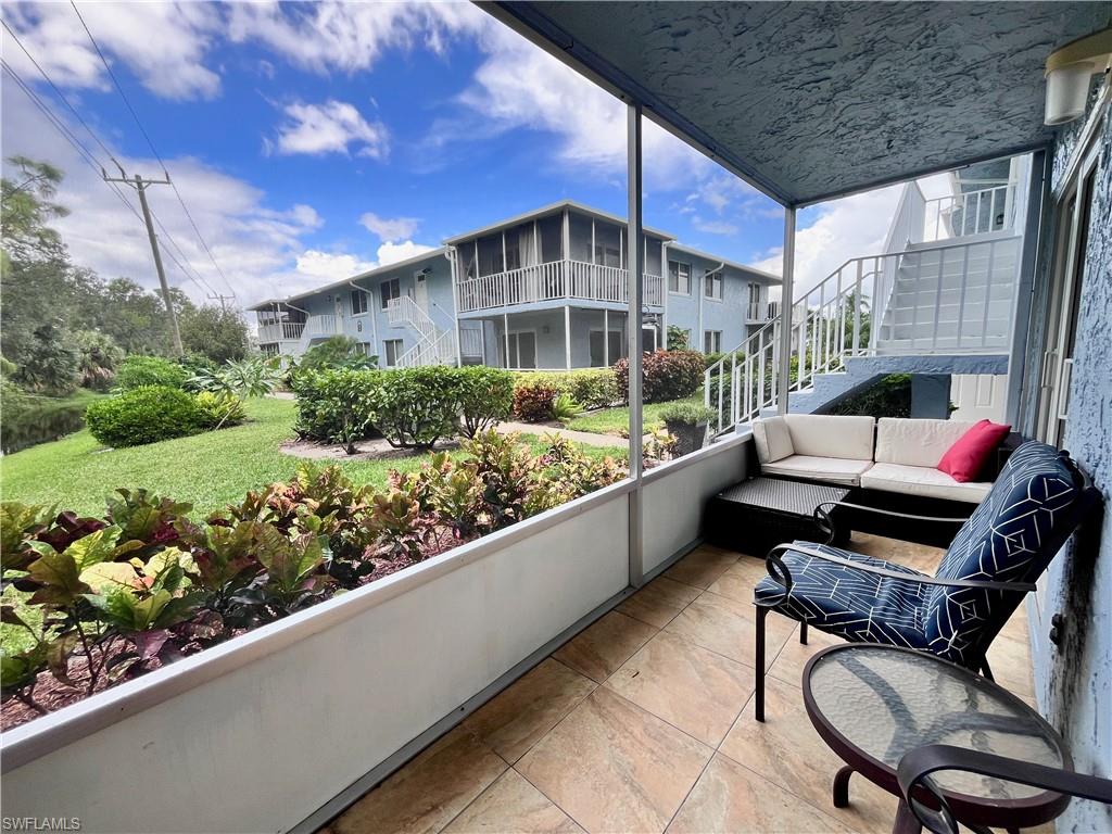 Screened in lanai overlooking the landscaped courtyard and the canal area