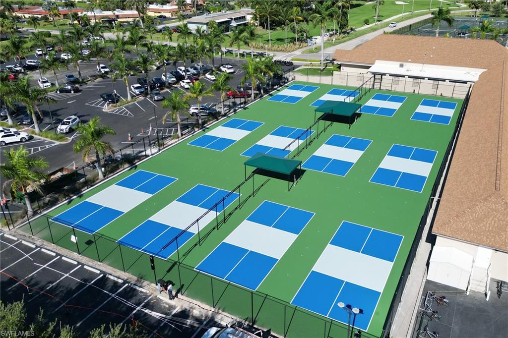 Drone / aerial view of the 12 Pickleball individually fenced, permanent competition courts.These courts are designed to deliver an uninterrupted playing experience with fewer errant balls and smooth court flow.