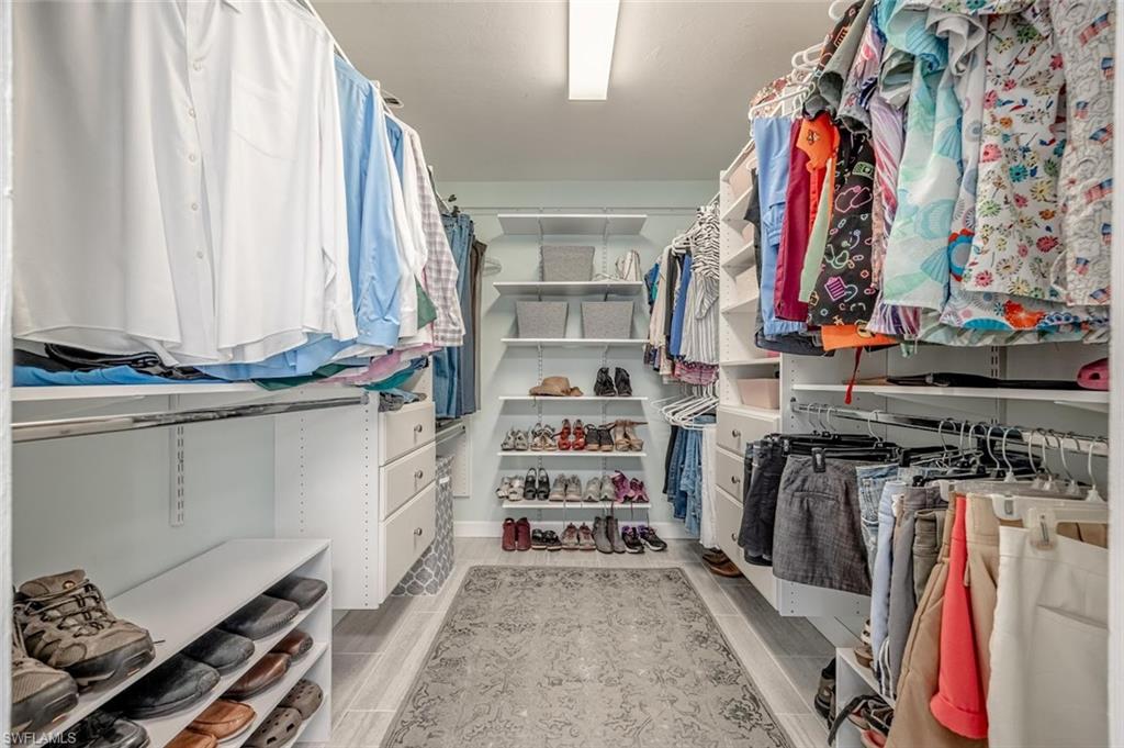 Spacious closet with wood tiled floors