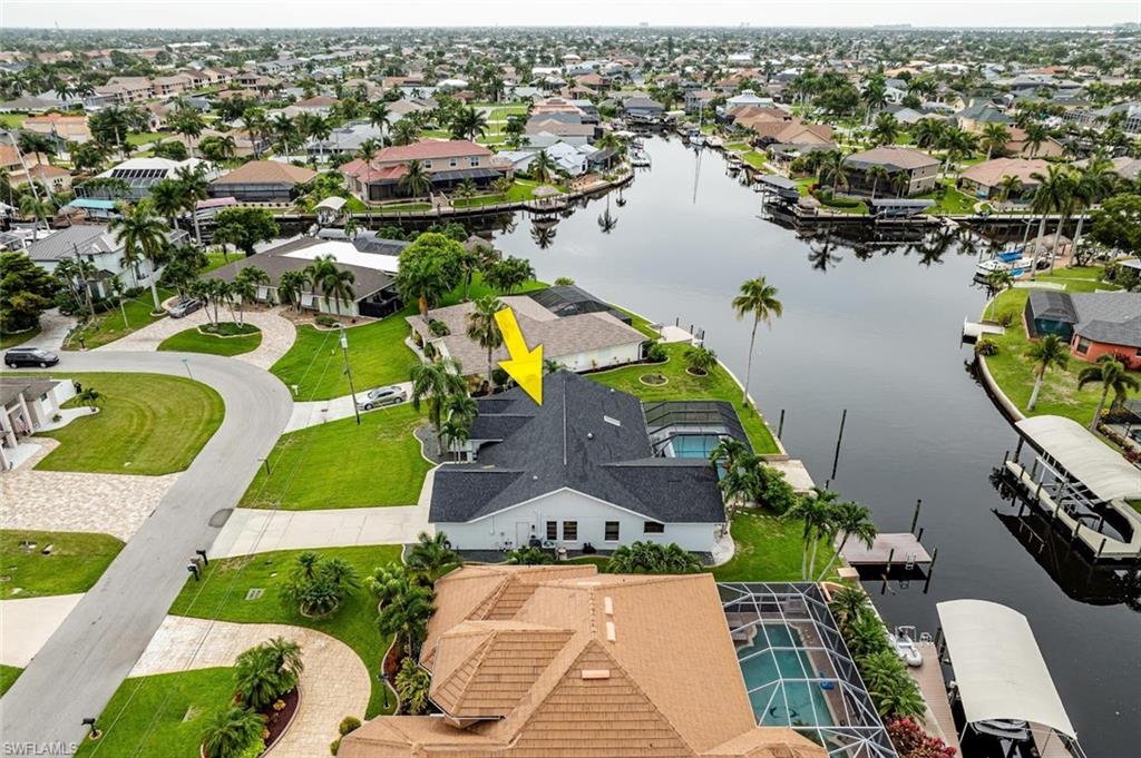 Aerial view of residential area with a nearby body of water