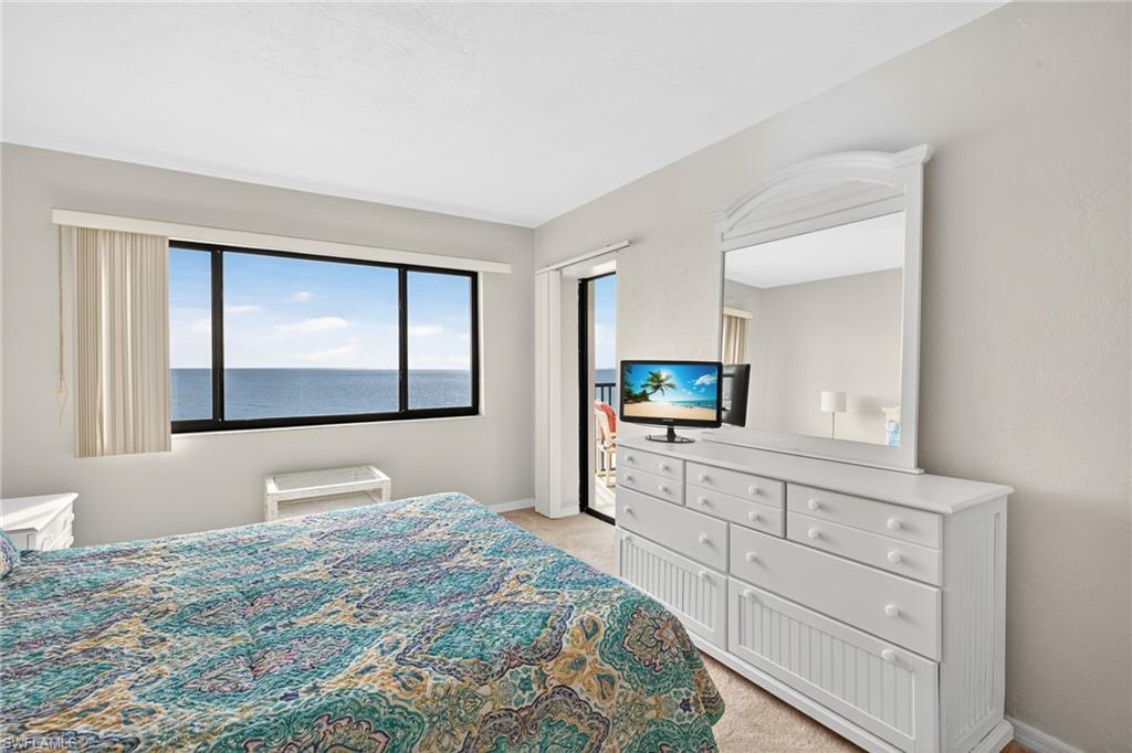 Bedroom featuring light colored carpet