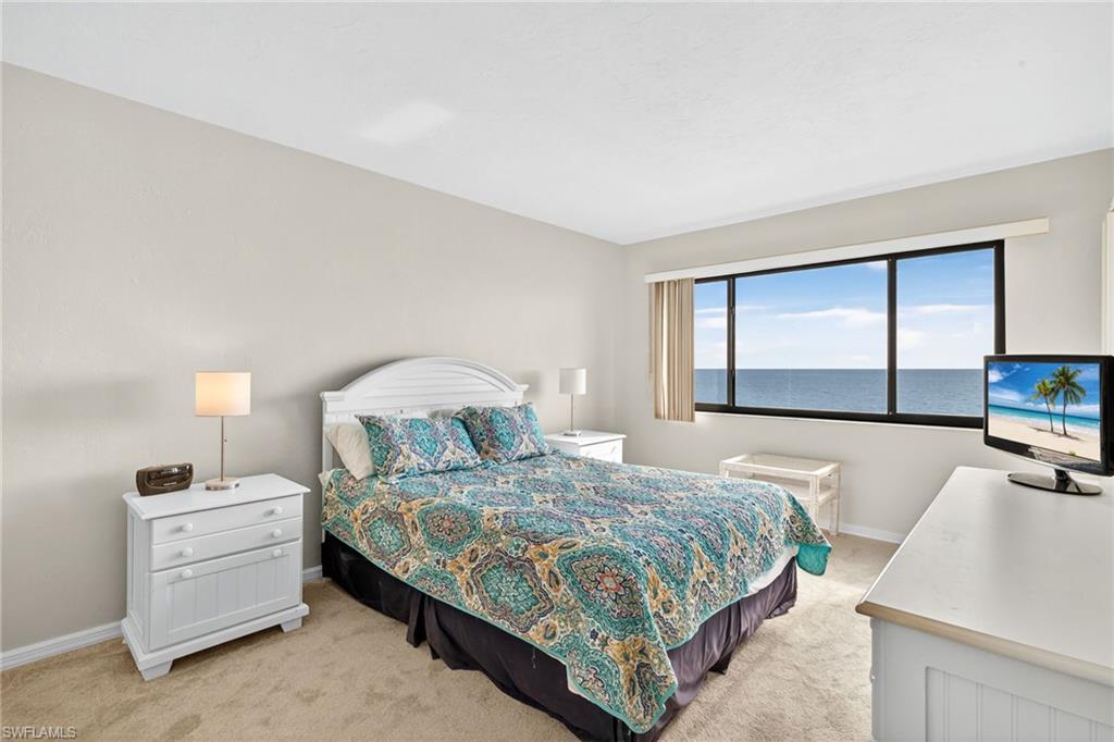 Bedroom with light carpet