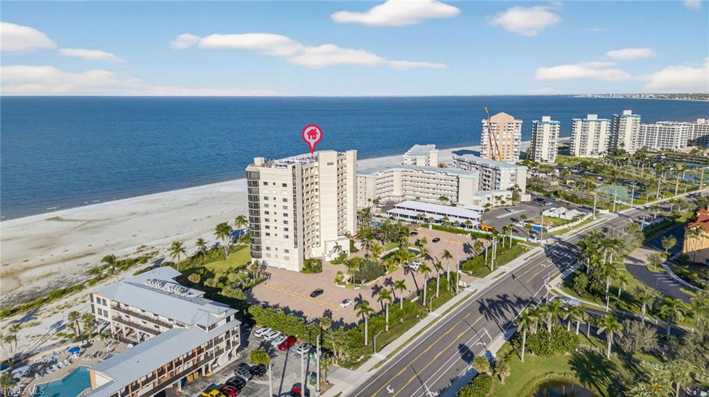 View of urban area with apartment complex / building and extended coastline