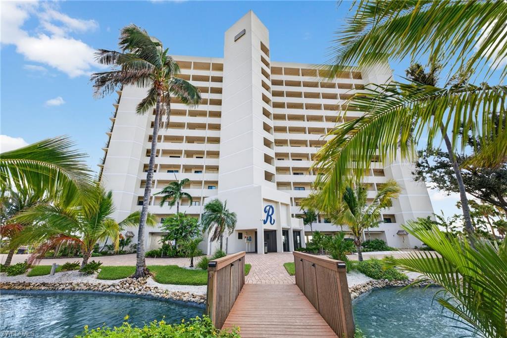View of apartment building / complex with a water view
