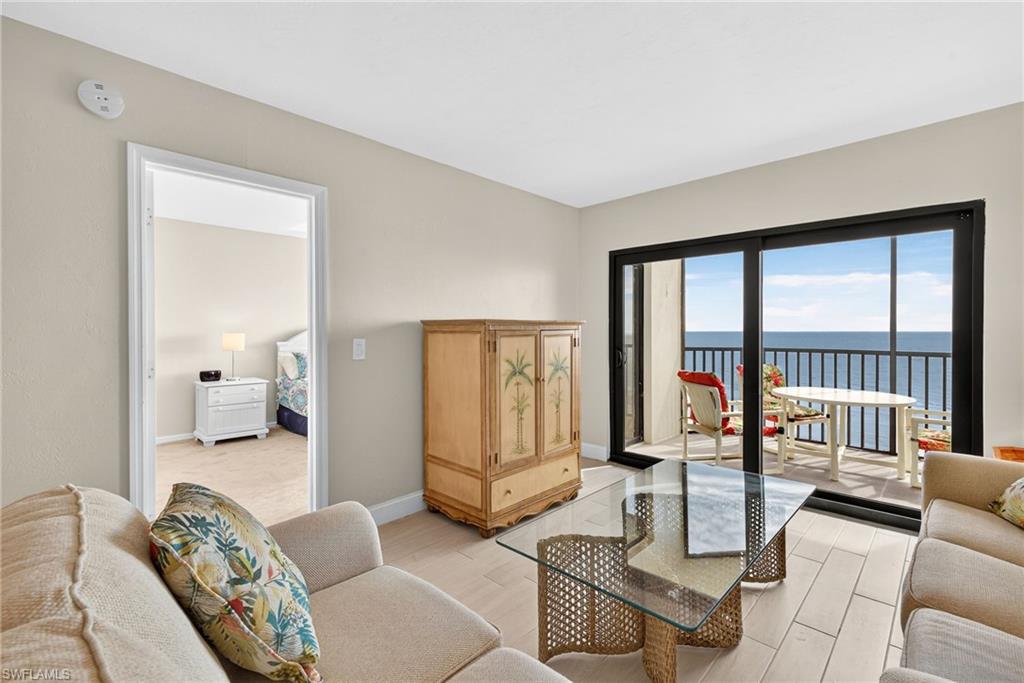 Living area with a water view and wood finished floors