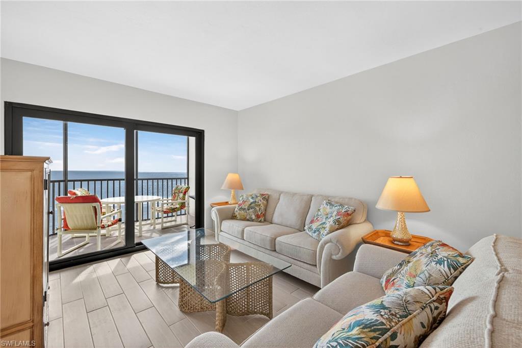 Living area featuring a water view and light wood finished floors