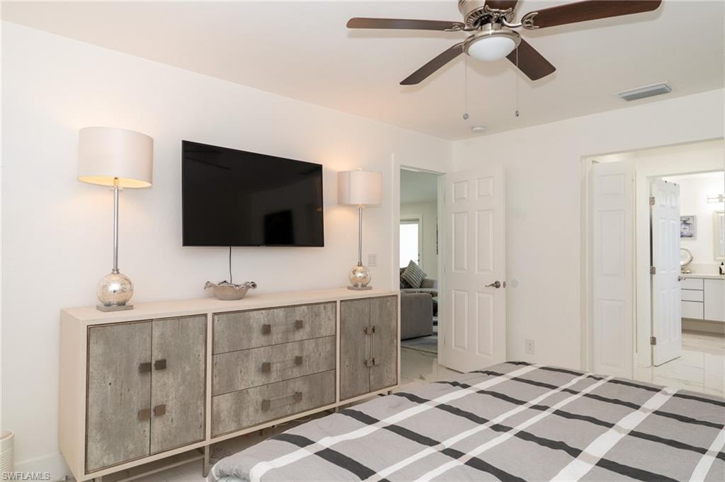 bedroom with ensuite bath and 2 walking closets.