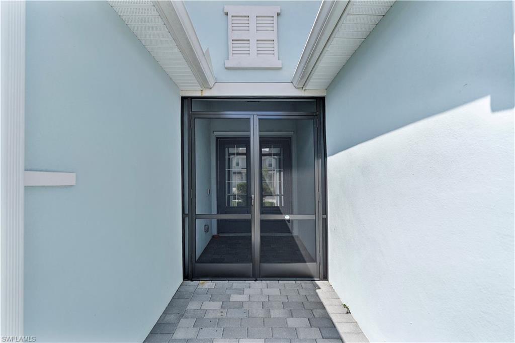 Property entrance with french doors