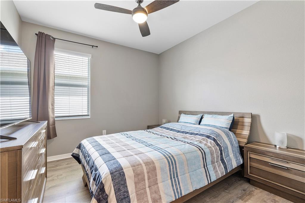 Bedroom with light wood-type flooring and ceiling fan