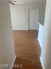 Hall featuring wood finished floors