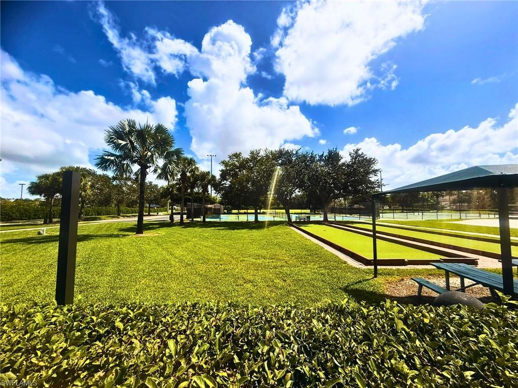 Surrounding community featuring a game area and a yard