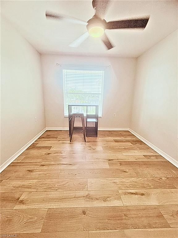 Unfurnished room featuring light wood finished floors and ceiling fan
