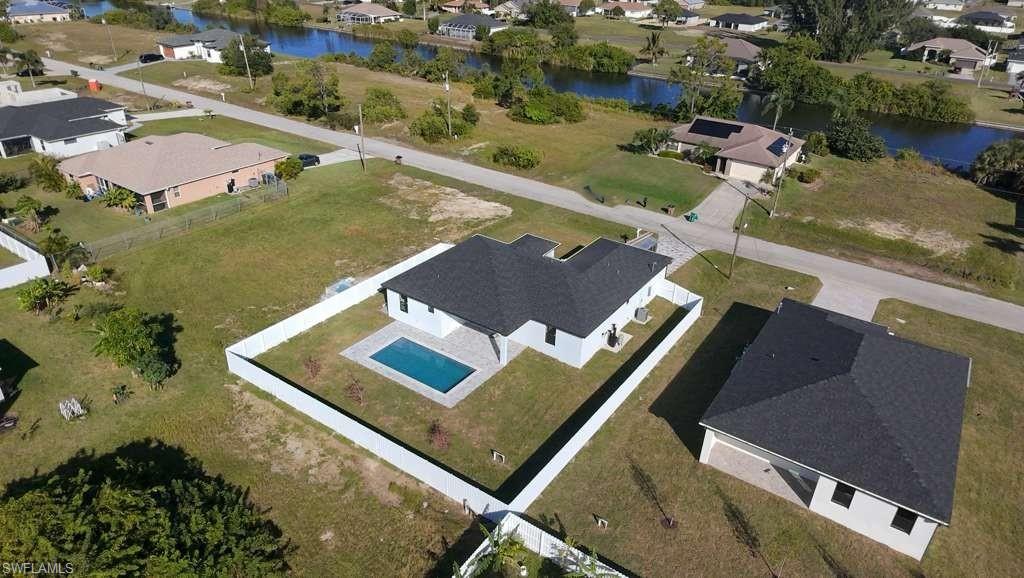 View of property location with nearby suburban area and a large body of water