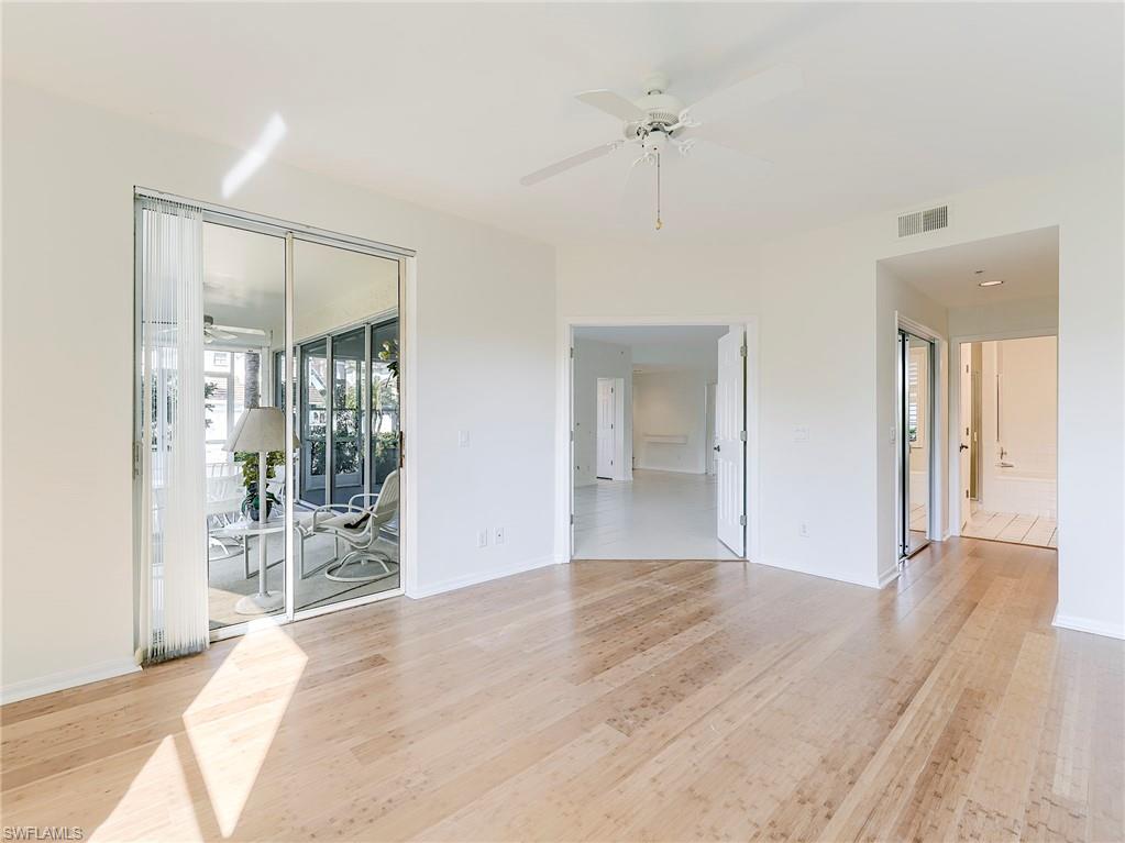 Spare room with a ceiling fan and light wood-type flooring