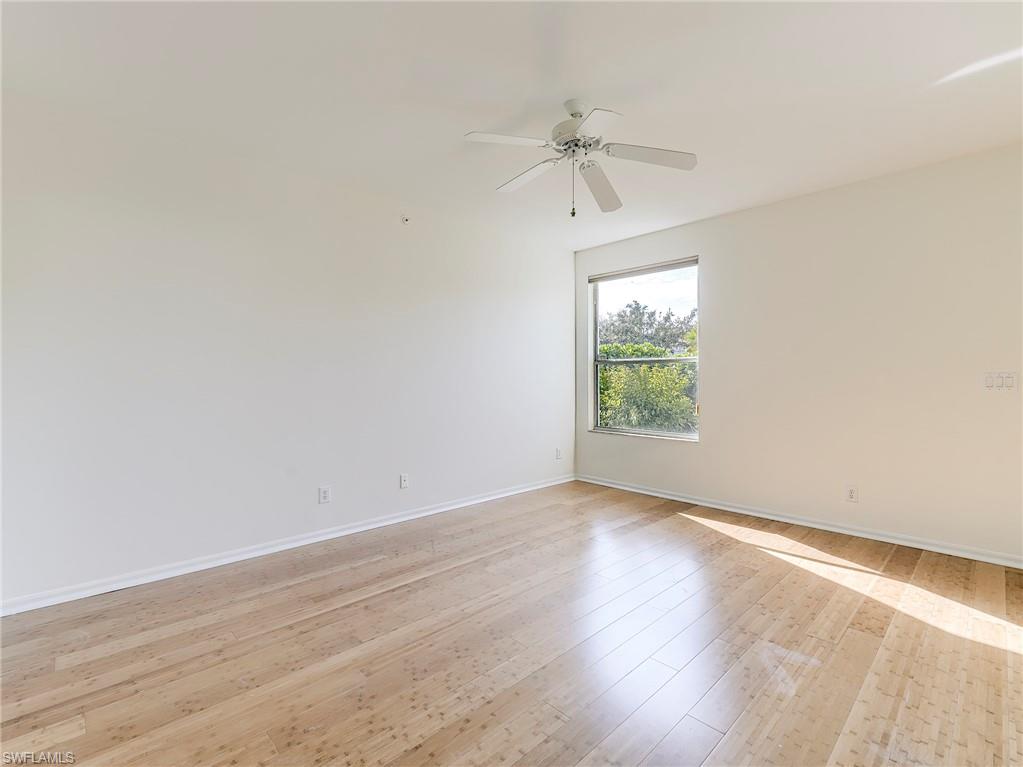Unfurnished room featuring light wood-style floors and a ceiling fan