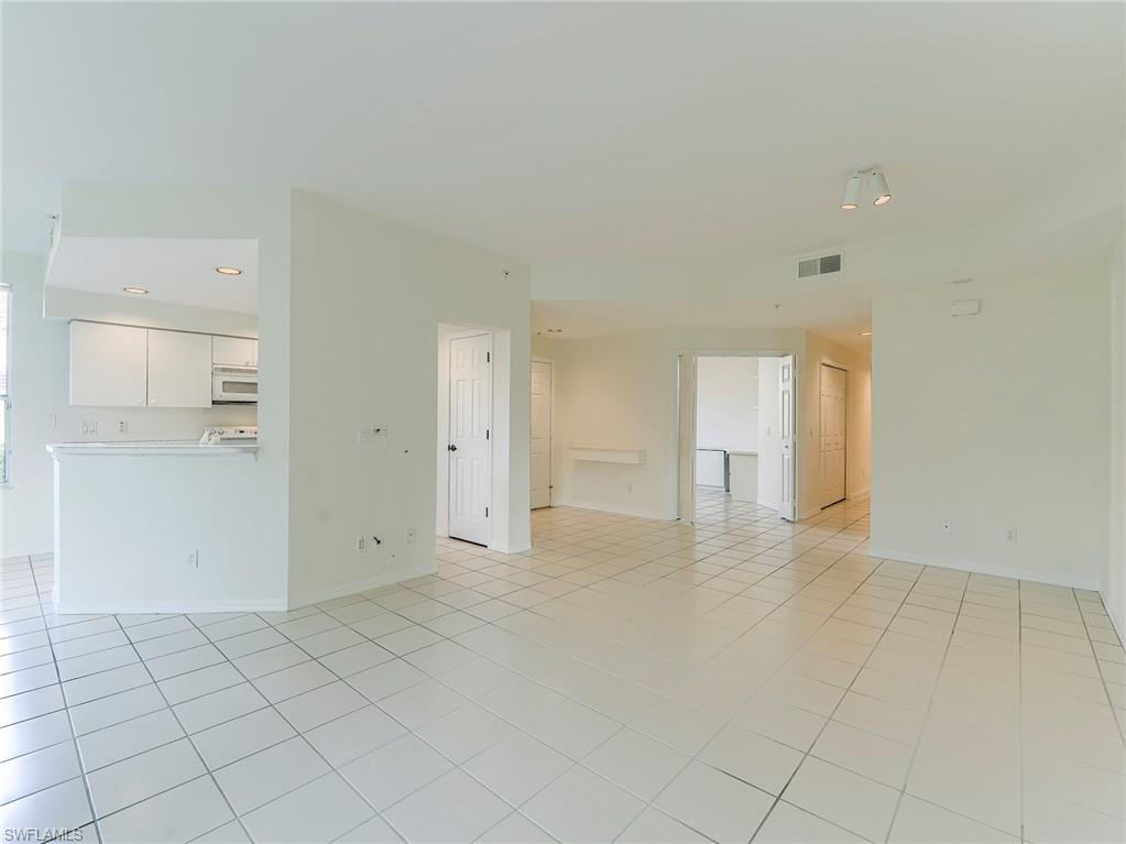 Spare room with light tile patterned floors and recessed lighting