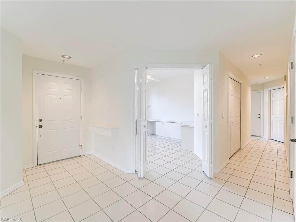Foyer featuring recessed lighting and light tile patterned floors