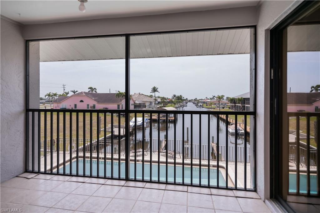 Balcony with a residential view and a sunroom